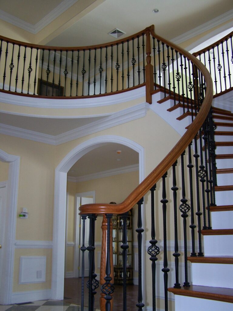 Traditional circular staircase in Bucks County, PA: Traditional circular staircase with iron balustrade, photo 3 of 13