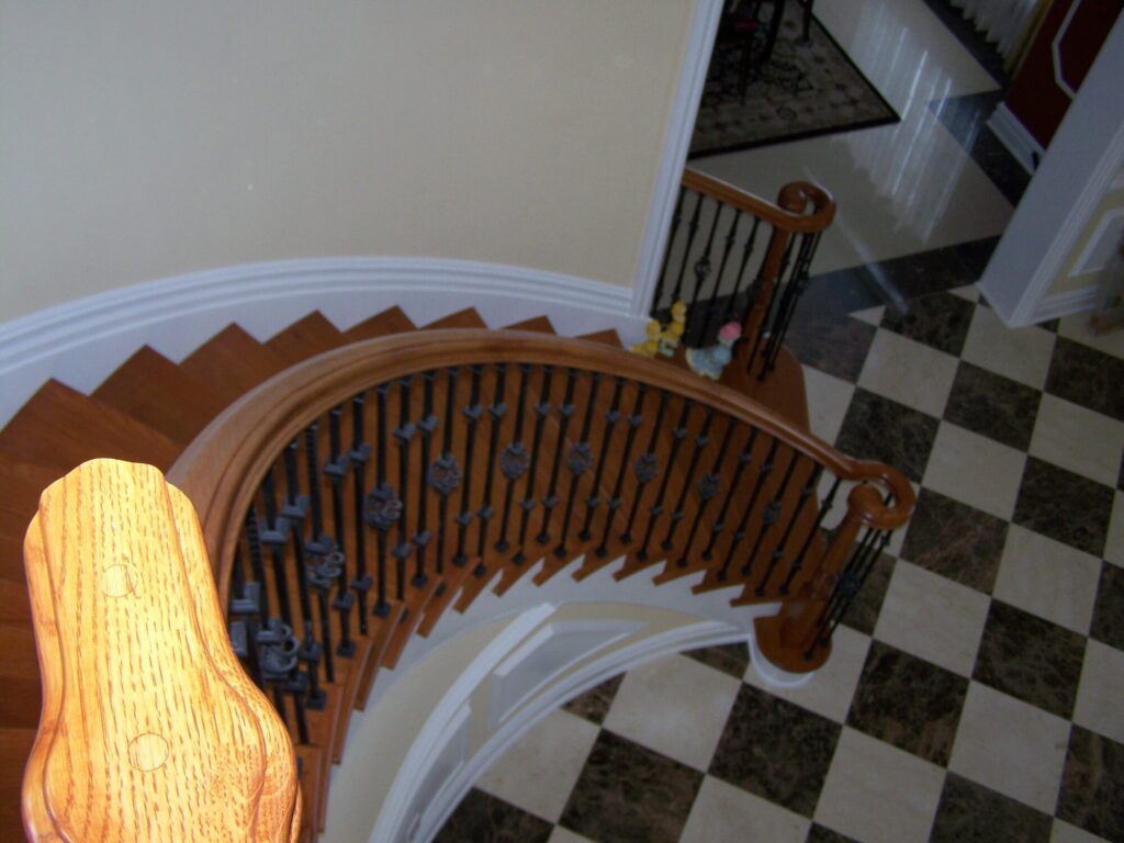 Traditional circular staircase in Bucks County, PA: Traditional circular staircase with iron balustrade, photo 11 of 13