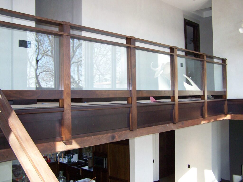 Modern solid walnut staircase with glass panel infill, photo 3 of 10