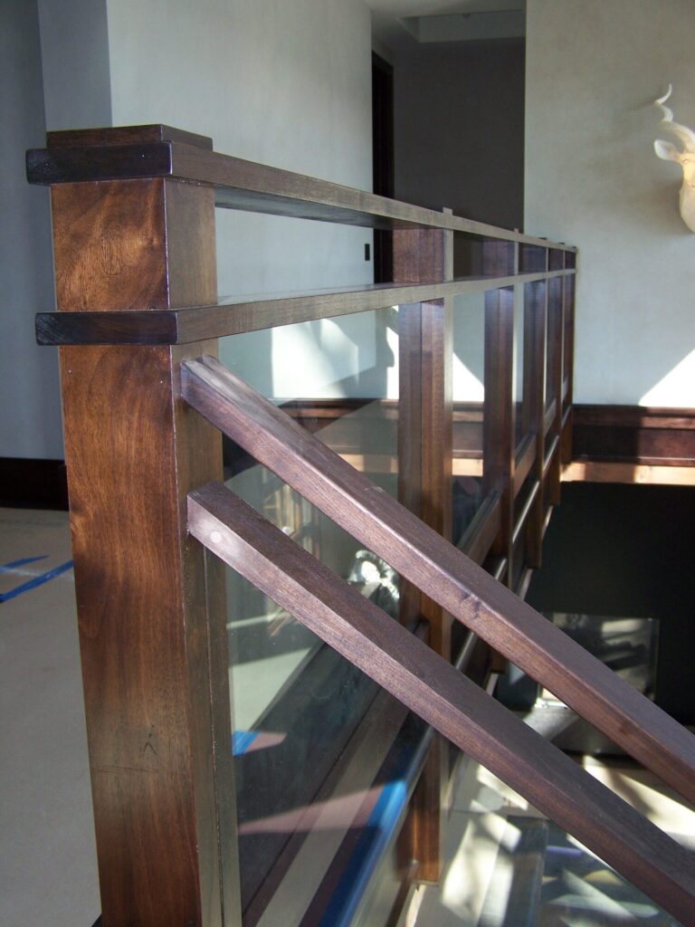 Modern solid walnut staircase with glass panel infill, photo 4 of 10