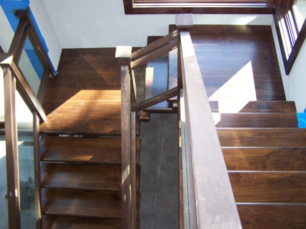 Modern solid walnut staircase with glass panel infill, photo 10 of 10