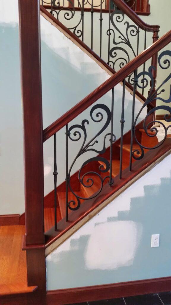 Traditional iron scroll infill with wood newel and handrails, photo 1 of 14