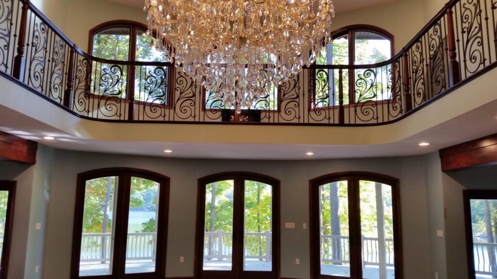Traditional iron scroll infill with wood newel and handrails, photo 6 of 14