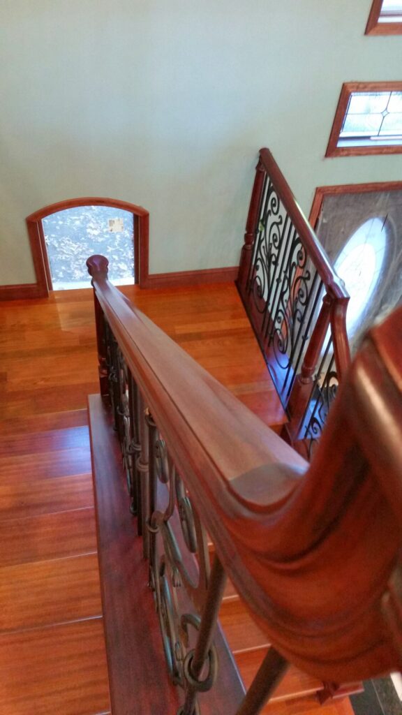 Traditional iron scroll infill with wood newel and handrails, photo 9 of 14