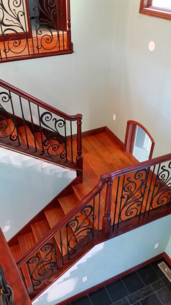 Traditional iron scroll infill with wood newel and handrails, photo 11 of 14