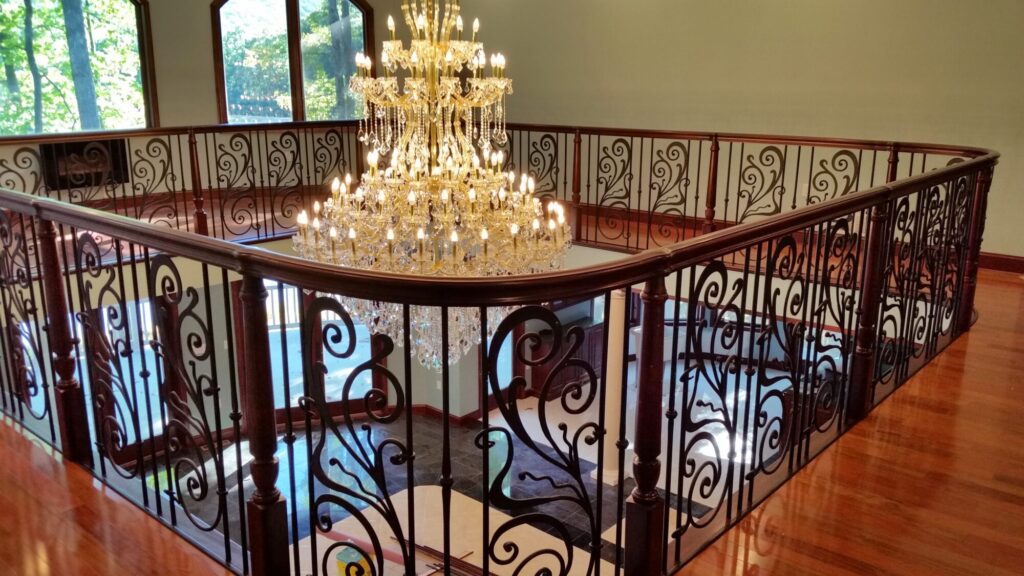 Traditional iron scroll infill with wood newel and handrails, photo 13 of 14