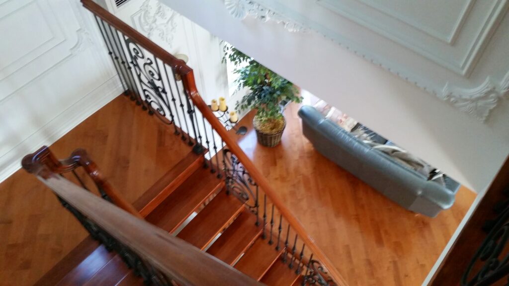 Modern open rise stair with vertical and scrolled balustrade: Solid maple stair and rail with iron balustrade, photo 12 of 21