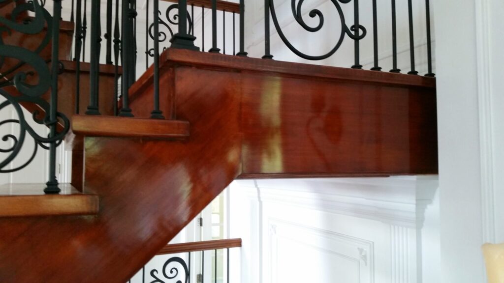 Modern open rise stair with vertical and scrolled balustrade: Solid maple stair and rail with iron balustrade, photo 15 of 21