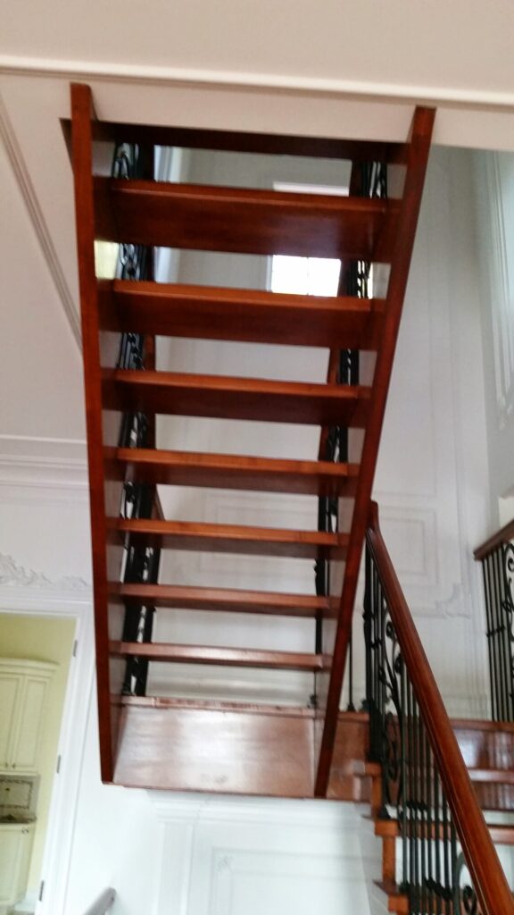 Modern open rise stair with vertical and scrolled balustrade: Solid maple stair and rail with iron balustrade, photo 17 of 21
