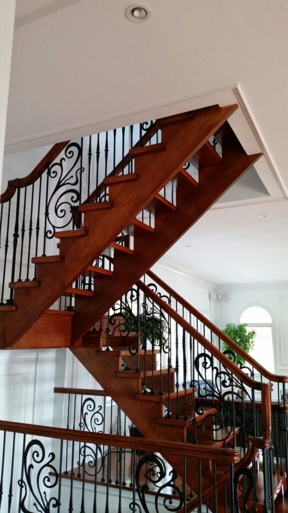 Modern open rise stair with vertical and scrolled balustrade: Solid maple stair and rail with iron balustrade, photo 19 of 21