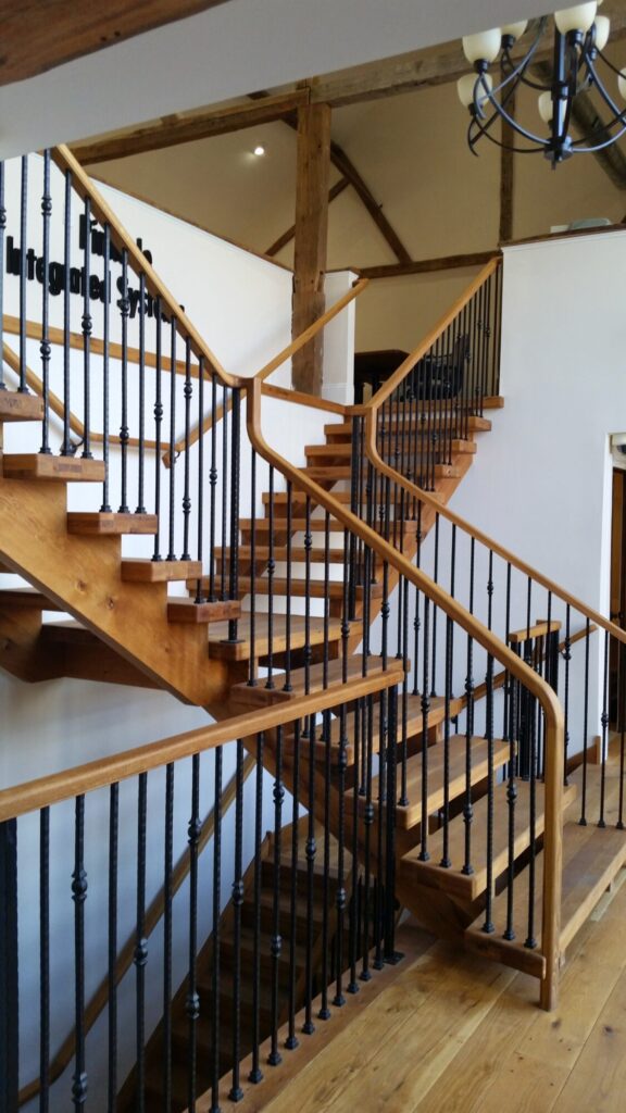 Rustic modern staircase with thick treads and hammered iron balusters: White oak treads with open risers, photo 1 of 10
