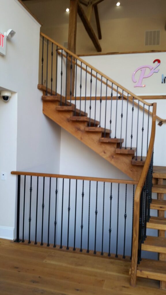 Rustic modern staircase with thick treads and hammered iron balusters: White oak treads with open risers, photo 2 of 10