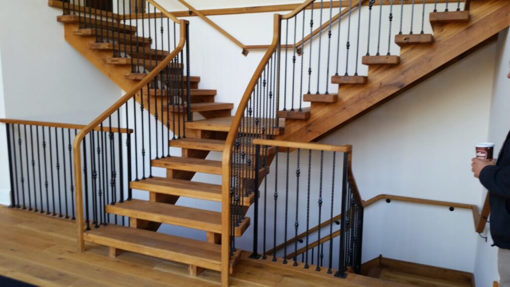 Rustic modern staircase with thick treads and hammered iron balusters: White oak treads with open risers, photo 4 of 10