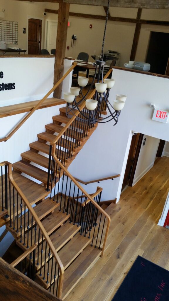 Rustic modern staircase with thick treads and hammered iron balusters: White oak treads with open risers, photo 7 of 10