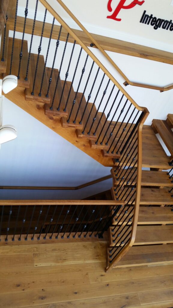 Rustic modern staircase with thick treads and hammered iron balusters: White oak treads with open risers, photo 8 of 10