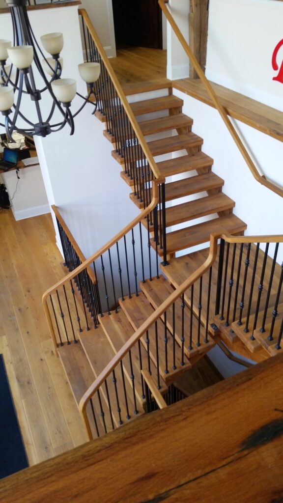 Rustic modern staircase with thick treads and hammered iron balusters: White oak treads with open risers, photo 10 of 10