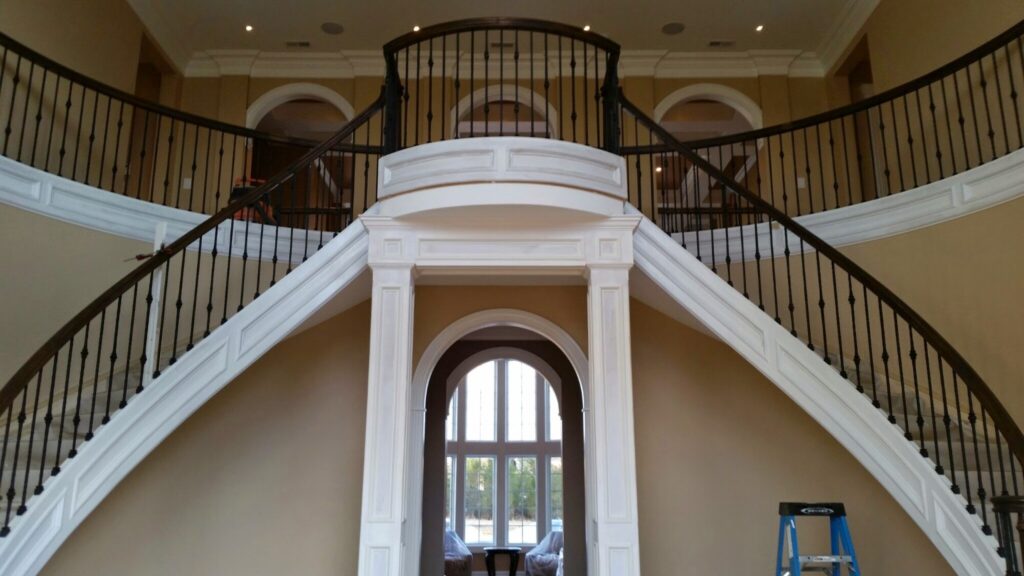 Mirroring circular staircase with closed stringer and raised panels, photo 2 of 8