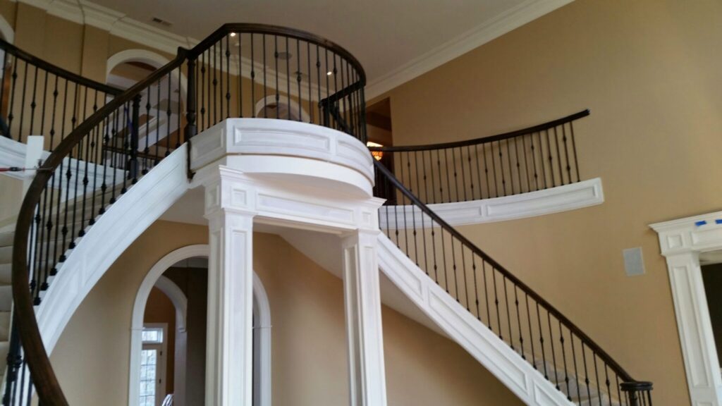 Mirroring circular staircase with closed stringer and raised panels, photo 3 of 8