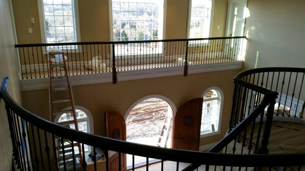 Mirroring circular staircase with closed stringer and raised panels, photo 5 of 8