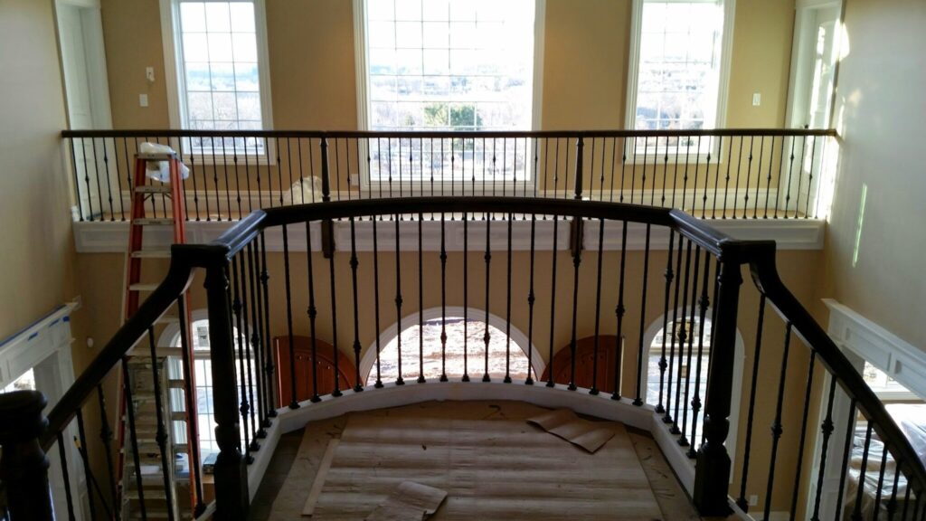 Mirroring circular staircase with closed stringer and raised panels, photo 6 of 8