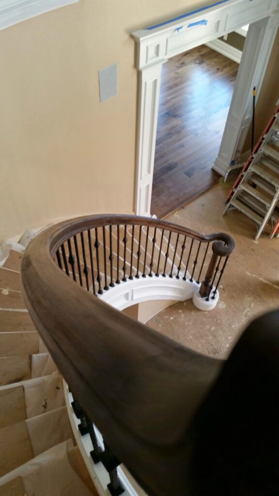 Mirroring circular staircase with closed stringer and raised panels, photo 7 of 8
