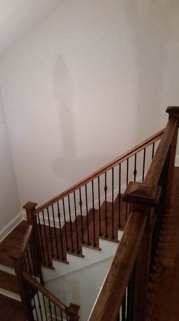 White oak square newel with simple cap and neck detail: Hammered rustic iron balustrade. Upper Makefield, PA, photo 13 of 17