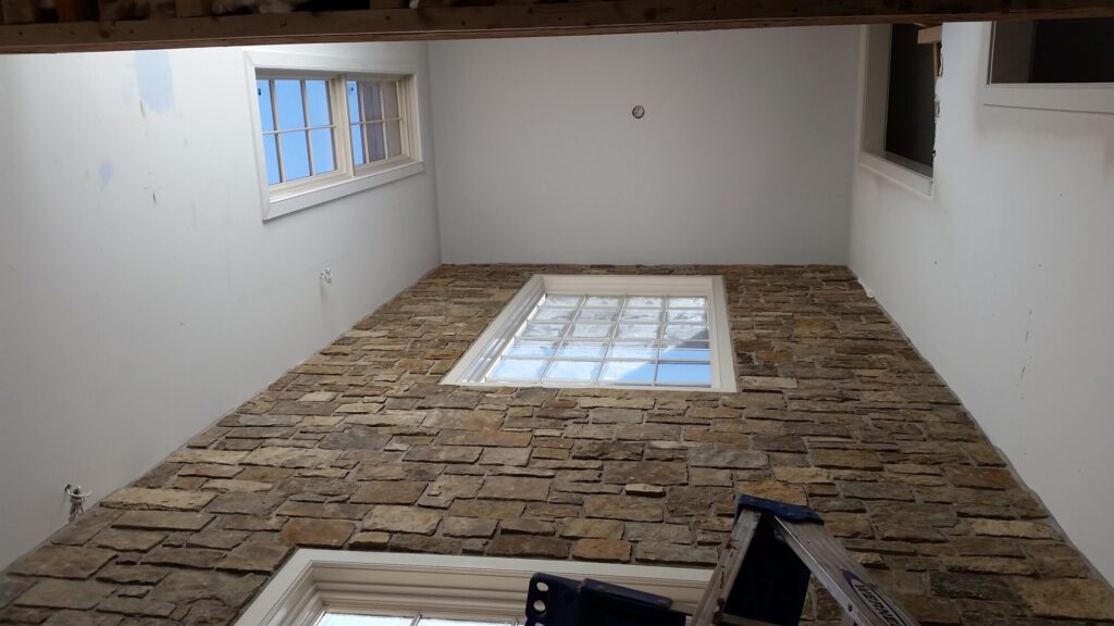 Solid hickory center stringer stair with hammered iron balusters. Carversville PA, photo 3 of 9