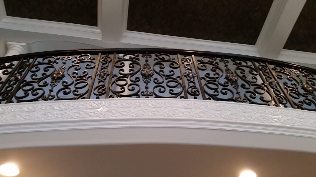 Custom mirroring circular stair with firenza scroll work, photo 2 of 10