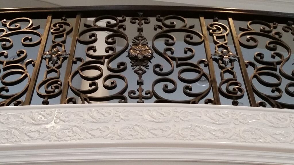 Custom mirroring circular stair with firenza scroll work, photo 3 of 10