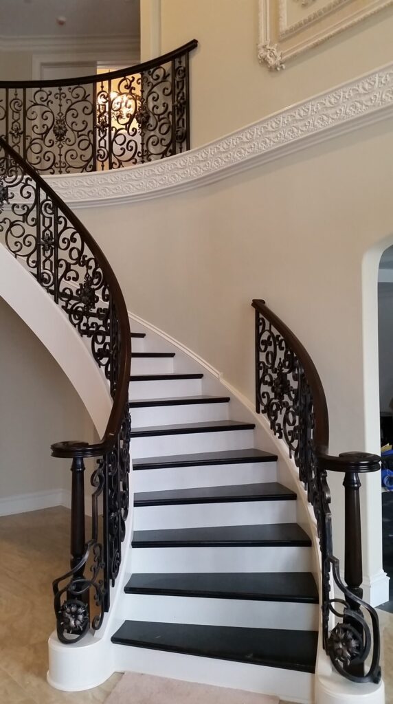 Custom mirroring circular stair with firenza scroll work, photo 7 of 10