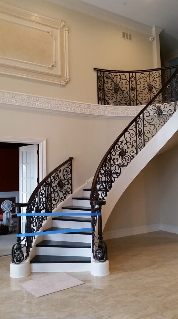 Custom mirroring circular stair with firenza scroll work, photo 8 of 10