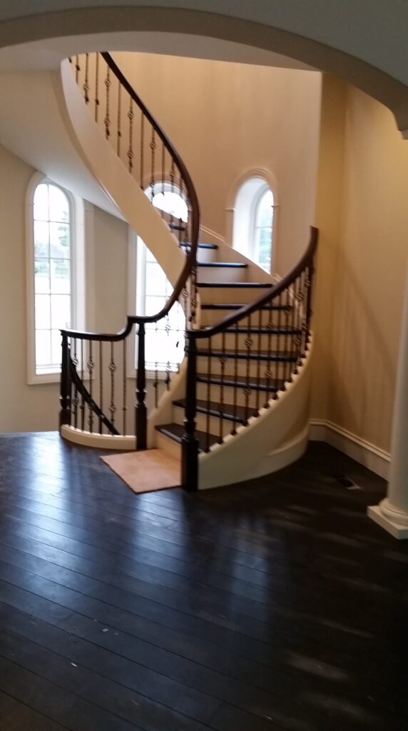 Custom mirroring circular stair with firenza scroll work, photo 9 of 10