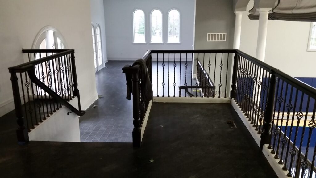 Custom mirroring circular stair with firenza scroll work, photo 10 of 10