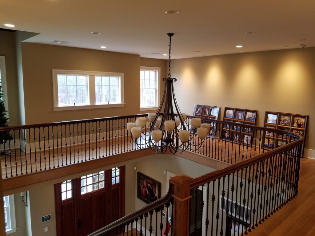 White oak and walnut staircase with custom box newel, photo 3 of 19