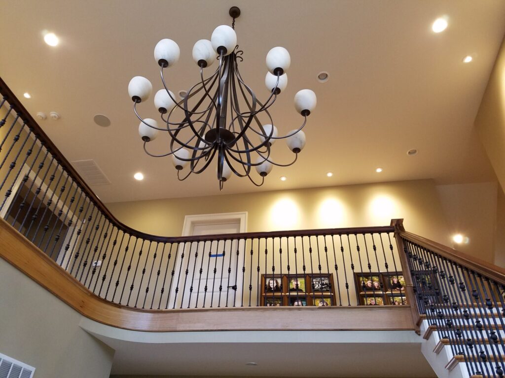 White oak and walnut staircase with custom box newel, photo 12 of 19