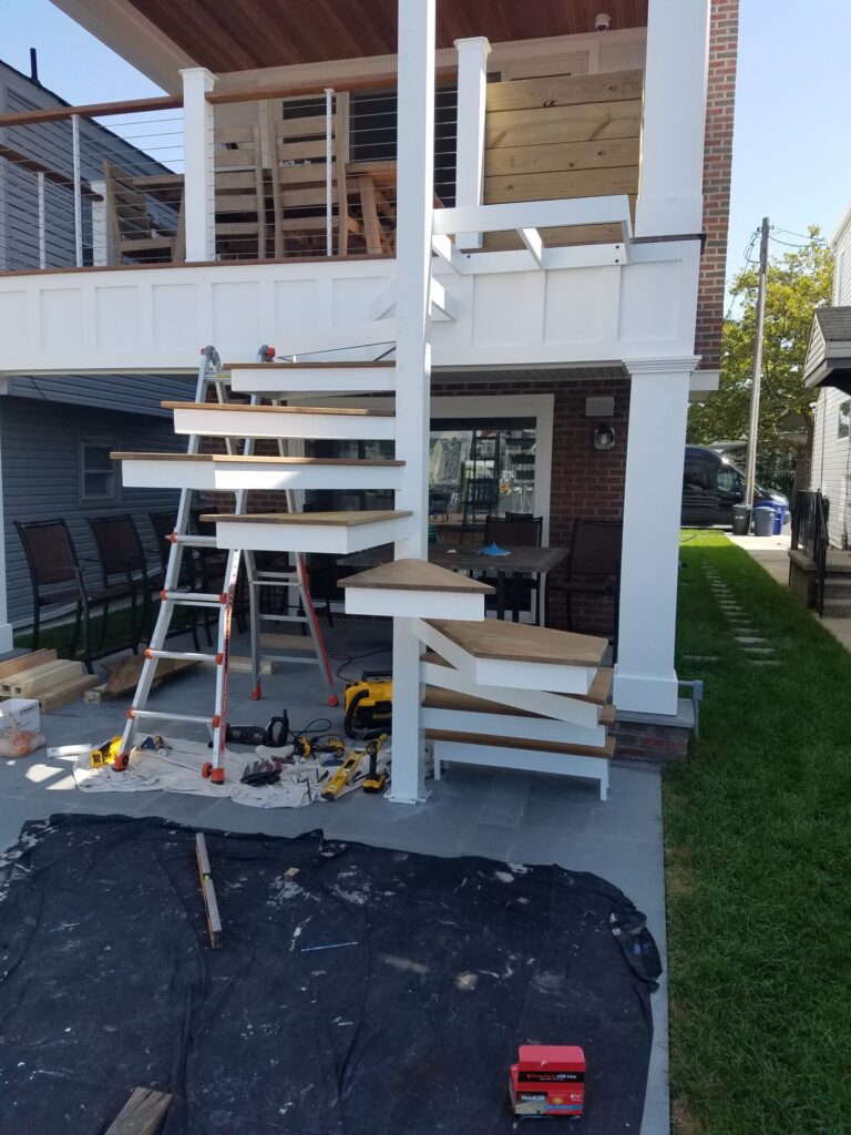 Aluminum square spiral in white with ipe treads and cable rail: Ocean City NJ, photo 4 of 11