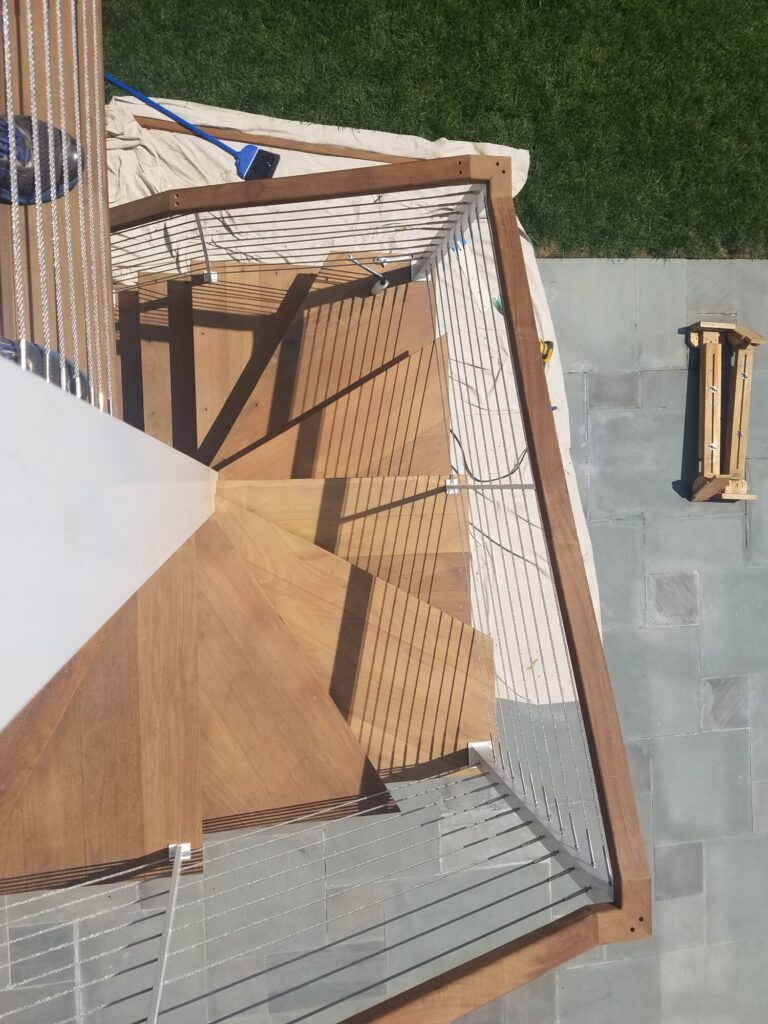 Aluminum square spiral in white with ipe treads and cable rail: Ocean City NJ, photo 8 of 11