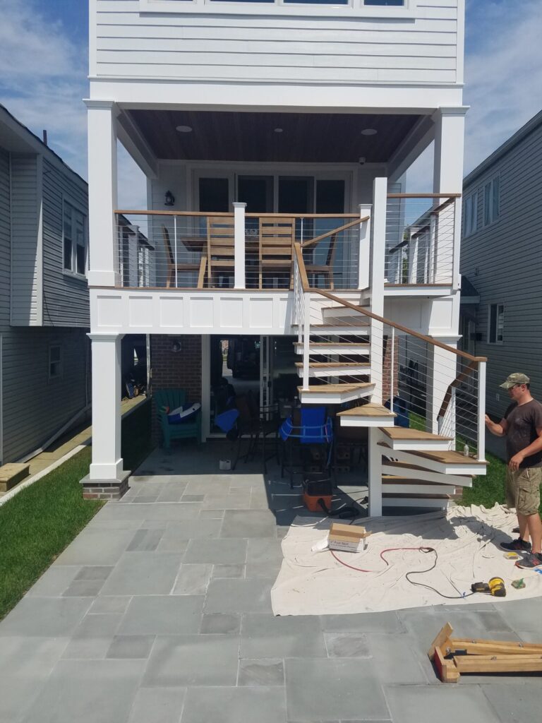 Aluminum square spiral in white with ipe treads and cable rail: Ocean City NJ, photo 3 of 11