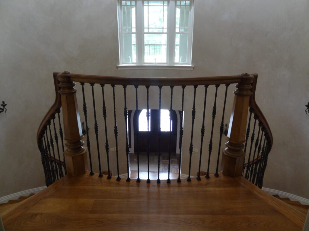 Mirroring curved staircase with iron balusters custom made hexagonal box newel: Solid hickory treads, risers and handrail, photo 1 of 15