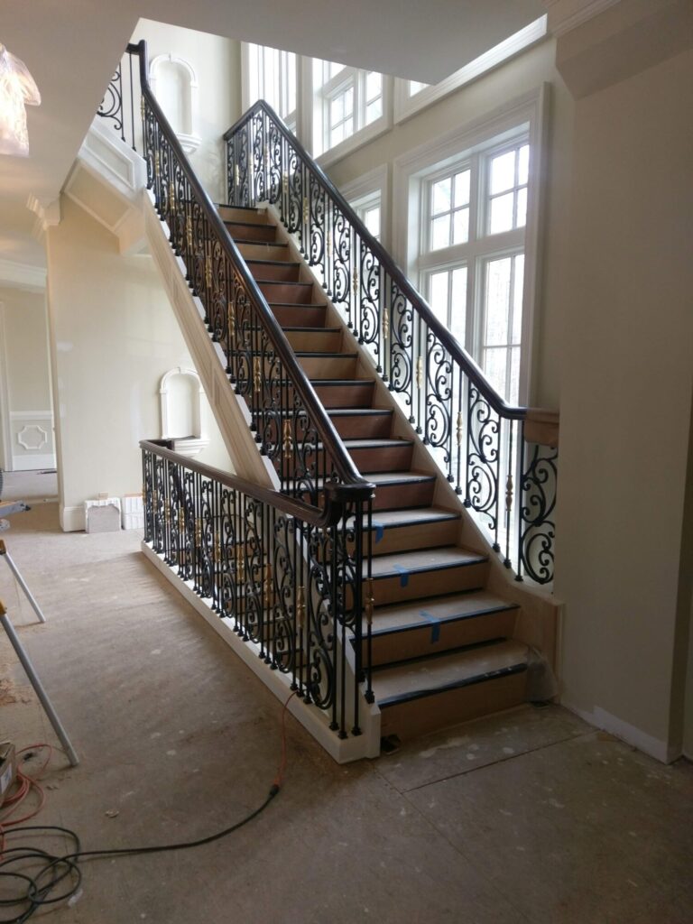 Tuscany wrought iron panels with curb stringer stair, photo 1 of 14