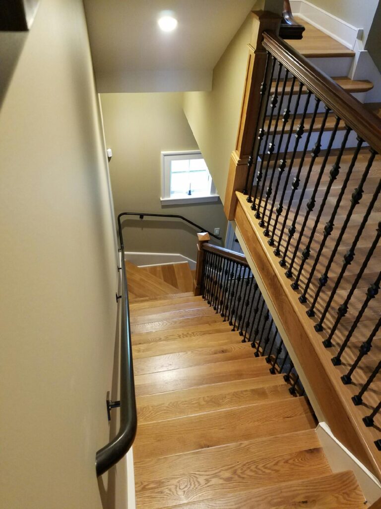 White oak and walnut staircase with custom box newel, photo 19 of 19